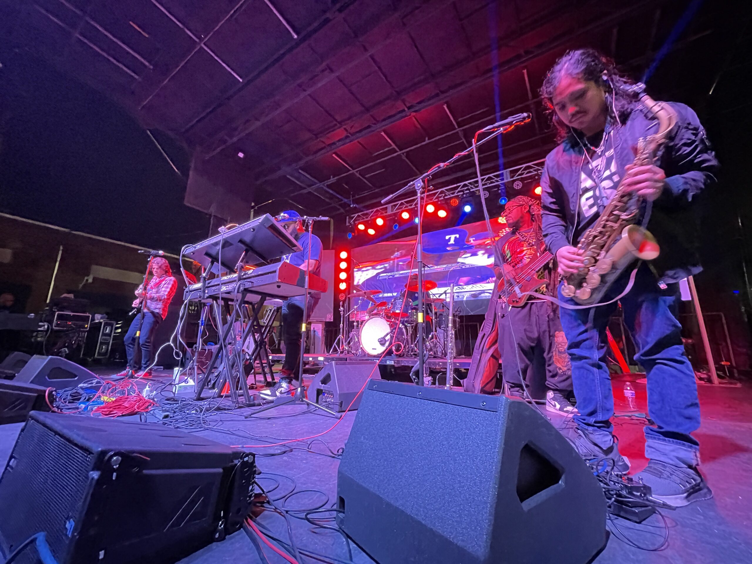 Musicians performing live on a Deep Ellum stage